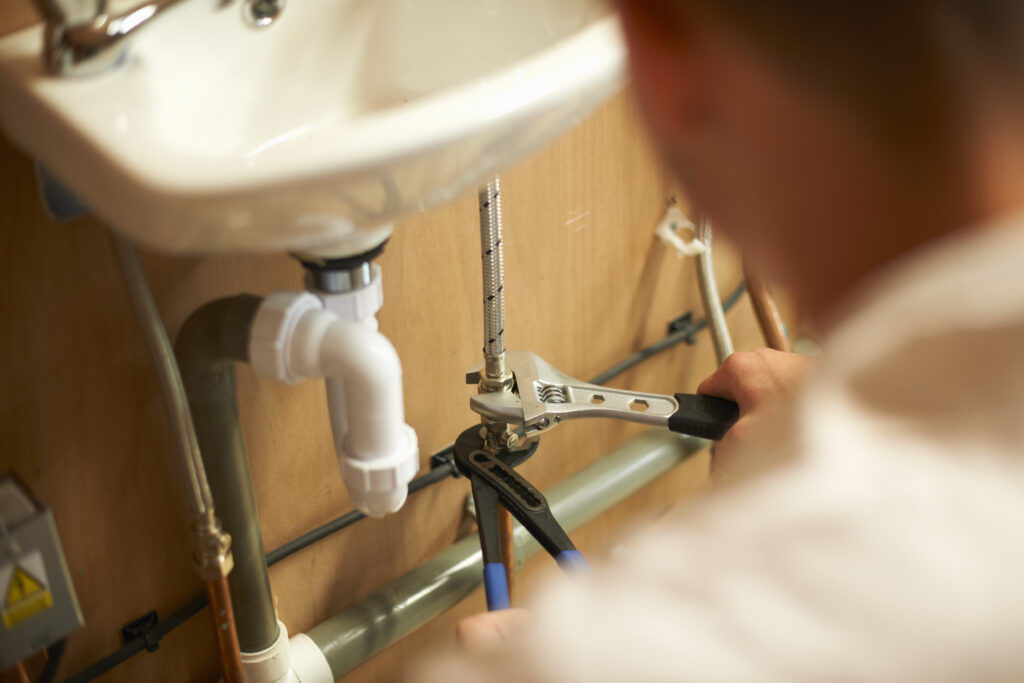 Male trainee plumber